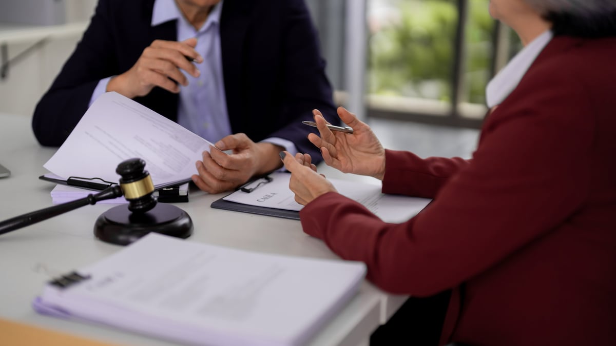 Asian adult legal professionals hands consult clients over important documents offering guidance in an office representing justice agreement